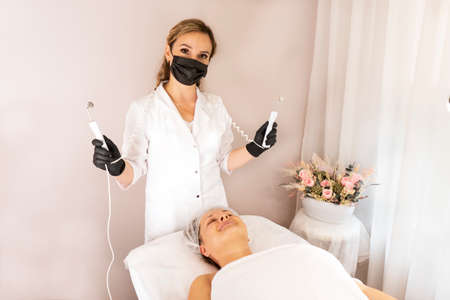 The cosmetologist is ready to do micro current therapy. Cosmetology beauty skincare anti-age lifting...