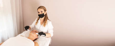 Micro current therapy. Cosmetology beauty procedure. Skincare procedure. Anti-age concept. Lymphatic...