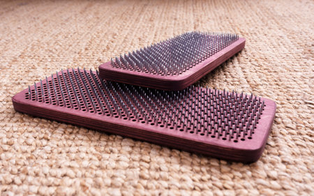 Sadhu board with sharp nail. Standing on nails as an alternative medicine.の写真素材