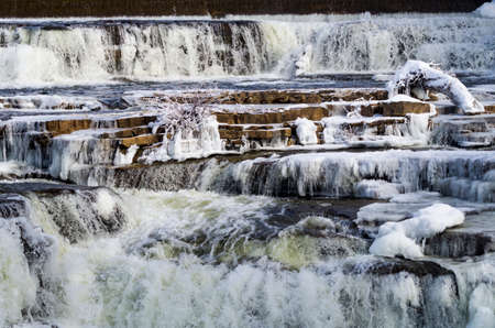 Waterfalls,ice and snow on the Mississippi River in Almonte, Ontario,Canadaの写真素材