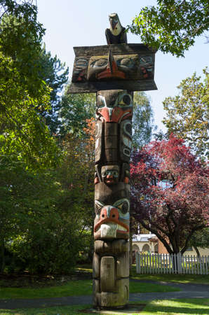 VICTORIA,BC CANADA SEPTEMBER 1,2013: Totem poles in Thunderbird park carved by indigenous Canadians. The park is part of the Royal BC Museums.のeditorial素材