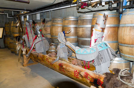 This Okanagan dugout canoe is adorned with characters and has been hand painted. It is stored in the Nk'MIP winery for safe keeping.のeditorial素材