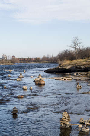 Every summer Inukshuks are built along the Ottawa River at Remics Rapids along the Ottawa River Parkway.の写真素材