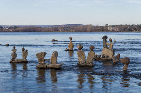 Every summer Inukshuks are built along the Ottawa River at Remics Rapids along the Ottawa River Parkway.の写真素材
