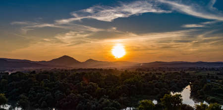 Mountain sunset / Landscape under the fading sun / River and mountains under the skyのeditorial素材