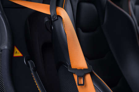 Orange seatbelt of luxurious carの写真素材