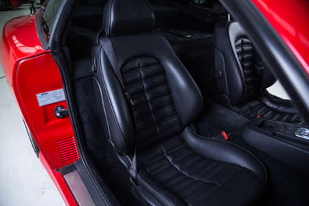 Detail of black leather sports car seatの写真素材