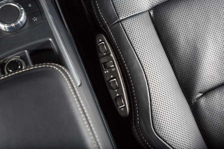 Close up of leather car seat control panelの写真素材