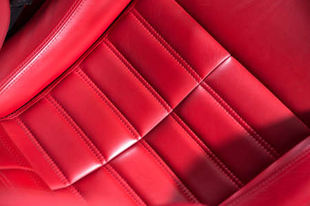 Close up of red leather car seat