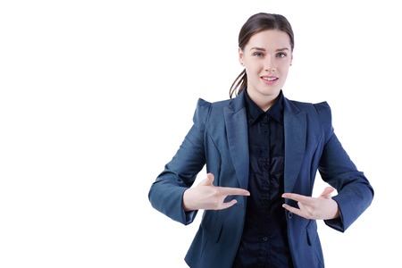 Smiling dark-haired girl model shows goat both hands. Celebration of success.の写真素材