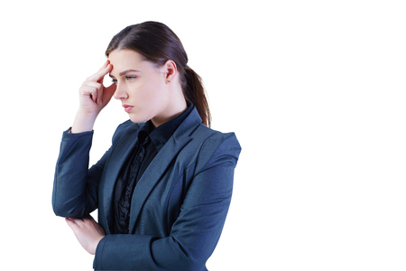 Portrait of a serious Caucasian business woman thinking on isolated white background.の写真素材