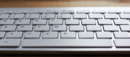 Computer keyboard and on the desk close up.の写真素材