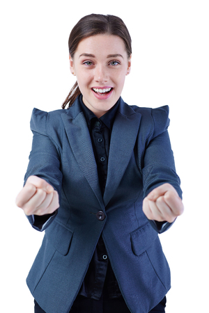Successfull business woman celebrating screaming of joy winning. Caucasian businesswoman cheerful for her success.の写真素材