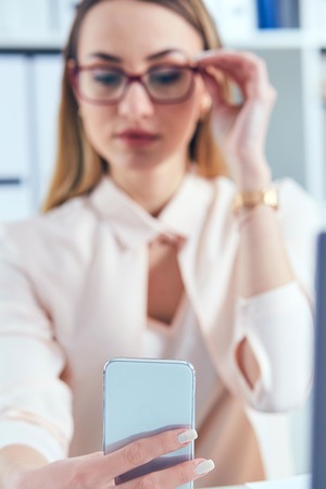 Young Caucasian business woman with headache isolated on white bの写真素材