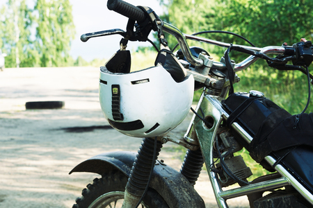 Motobike helmet on enduro motorcycle closeup.の写真素材