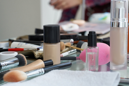Different brushes for cosmetics. Make up table with professional makeup brush. Visagiste tools.の写真素材
