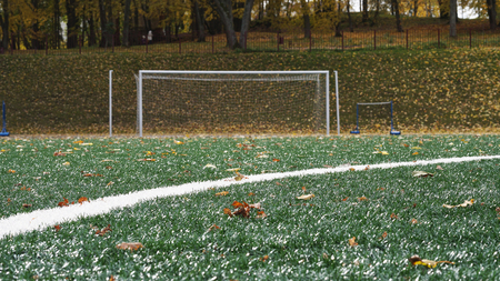 Soccer gates in stadium with artificial turf in autumn time.の写真素材