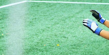 Young goalkeeper hands facing a penalty kick.の写真素材