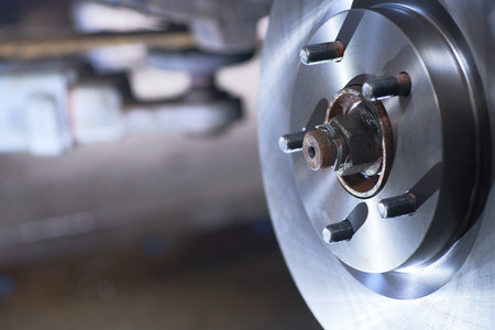Replacing the brake disc in a passenger car.の写真素材
