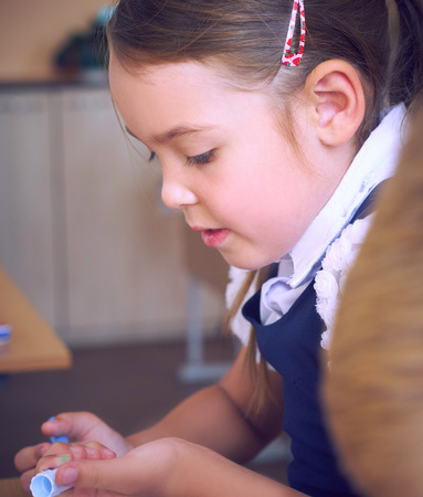 Little girl holding felt-tip pen, selective focus. Creative art hobby, early development and inspiration concept, copy spaceの写真素材