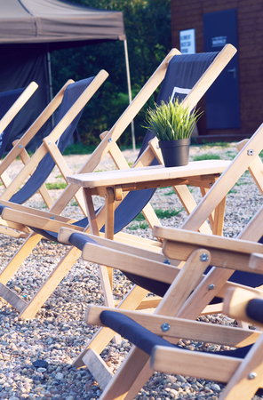 Large number of empty chairs at luxury villanear the sea or lake.の写真素材
