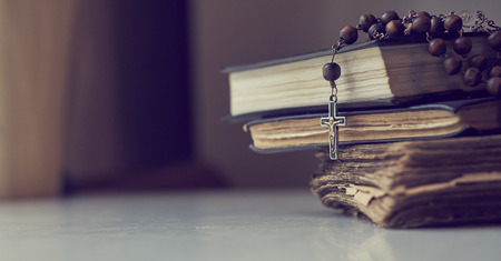 The rosary beads on Catholic Church liturgy books.の写真素材