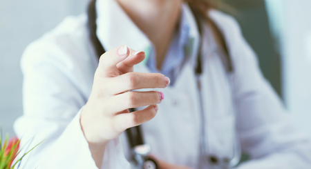 Closeup female health care professional, woman doctor pointing finger, you did something wrong.の写真素材