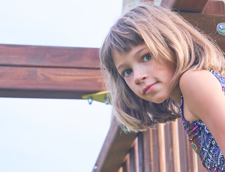 Portrait of little girl in swimsuit on sunny day outside. Concept of summer recreation, travel and enjoy lifeの写真素材