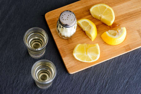 Tequila with salt and lemonsの写真素材