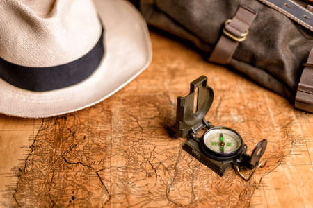 Old expedition map with compass and binocularsの写真素材