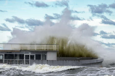 Big braking waves during a gale at Kolobrzeg on the coast of the Baltic sea in Polandの写真素材