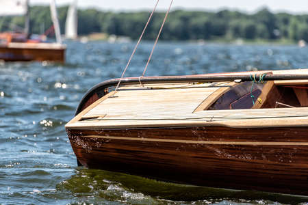 stern of a classic sailing yacht sailing on a lake during a regattaのeditorial素材