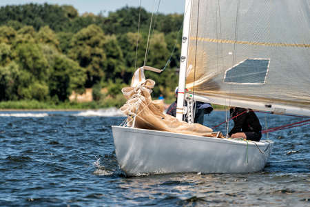 classic sailing yacht sailing on a lake during a regatta