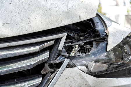 heavy damaged car at the roadside after an accidentの写真素材