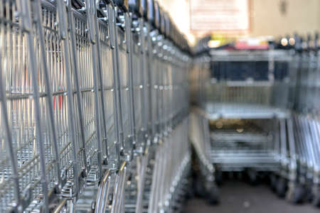 queue of shopping carts in a shopping mallの写真素材