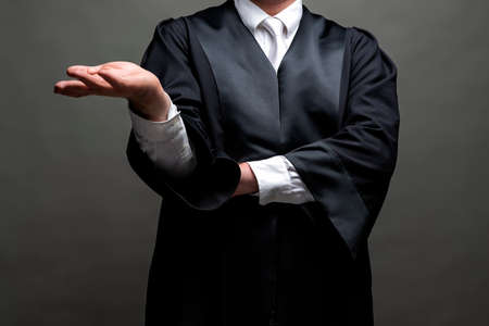 german lawyer with a classical black robe and white tieの写真素材