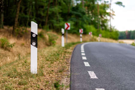 country road in Germany with a sharp turnの写真素材