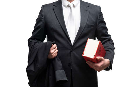 german lawyer with a classical black robe, white tie and bookの写真素材