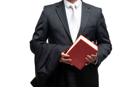 german lawyer with a classical black robe, white tie and bookの写真素材