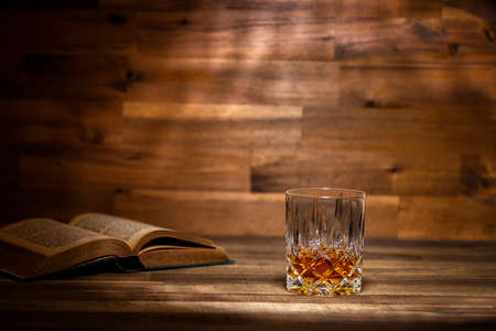 glass of rum and old book in a bar in Cubaの写真素材