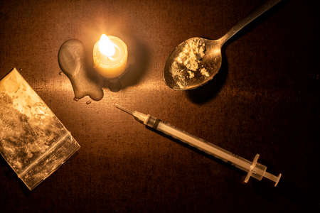 injection, candle and Heroine of a junkie