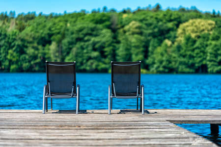 lake with bathing stage in summer in Europeの写真素材