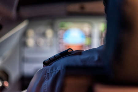 pilots in a cockpit in an airplane during flightの写真素材