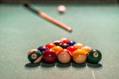 Billiard table in an old castle with billiard balls and billiard cues