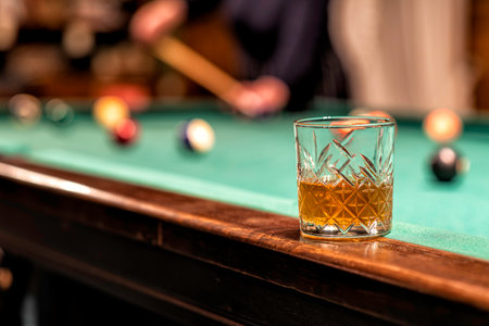 Glass of Rum on a billiard table in an old castle with billiard balls and billiard cuesの写真素材