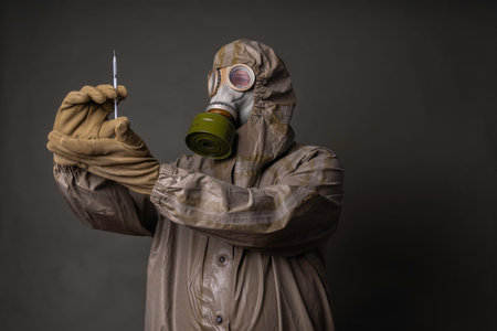 Soldier in a protective suit with a gas mask during a disaster drillの写真素材