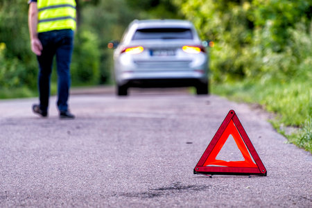 damaged car on a country road after a breakdownの写真素材