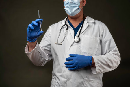 doctor with doctor's coat and a stethoscope in a hospitalの写真素材