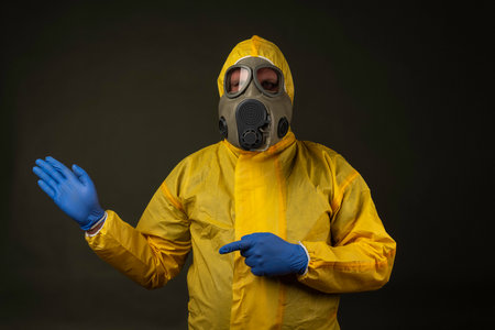 man in a protective suit with a gas mask during a disaster drillの写真素材
