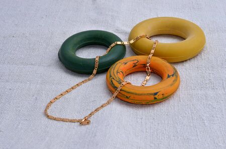 expanders, a gold chain on a dedicated white backgroundの写真素材